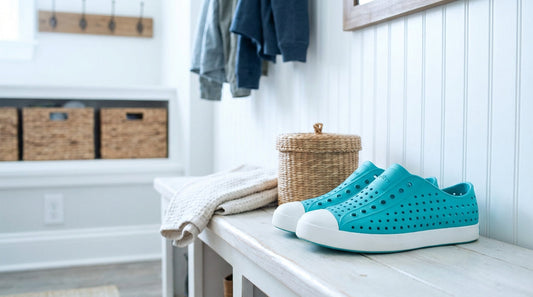 Teal Native Jefferson shoes for kids on a mudroom bench to prevent odors.